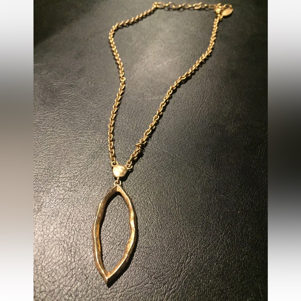 Antique Gold abstract oval pendant long necklace and dangling earrings.